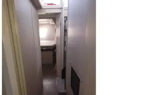 Narrow hallway inside 2018 Leopard 45 yacht, featuring modern interior design.