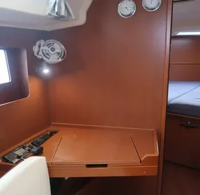 Interior of 2019 Beneteau Oceanis 41.1 yacht with navigation station and fan.