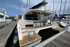 2019 Leopard 45 catamaran docked at marina, rear view.