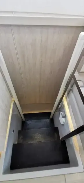Staircase inside 2019 Leopard 51 Powercat yacht with wooden paneling.