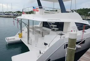 2022 Leopard 43 Powercat yacht docked at marina, rear view.