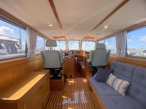 Saloon, full of light and great views! Helm positions fwd, seating to starboard, with chart drawers under drinks cabinet, to port