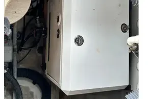 Engine compartment of 2023 Beneteau Oceanis 51.1 sailboat, featuring mechanical components and wiring.