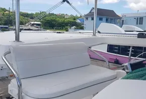 Leopard 48 yacht deck with white seating, docked in a marina, 2017 model.