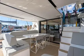 Luxurious Leopard 46 yacht interior, featuring modern seating and dining area, 2025 model.