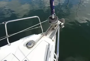 Beneteau Oceanis 46.1 2020 yacht bow with anchor and chain in water.
