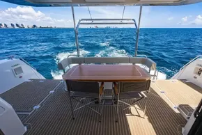 Leopard 40 Powercat 2025 yacht deck with ocean view and dining table.