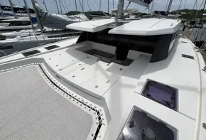 2019 Leopard 45 catamaran docked at marina, featuring spacious deck and modern design.