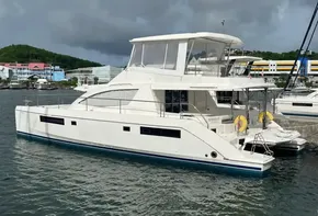 2019 Leopard 51 Powercat yacht docked in marina, overcast sky.