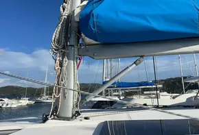 Leopard 45 catamaran sailboat with blue sail cover, docked in a marina, 2019 model.