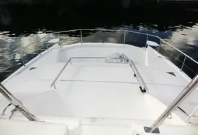 2018 Leopard 43 Powercat bow deck with railing on calm water.