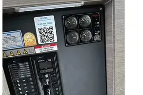 Electrical panel of 2022 Leopard 53 Powercat with gauges and QR code for support.