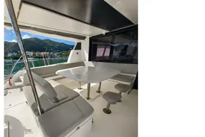 Luxurious Leopard 50 yacht interior with seating and table, 2021 model, scenic water view.