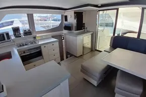 Luxurious interior of 2018 Leopard 45 yacht with modern kitchen and dining area.