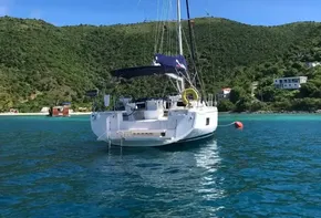 2020 Beneteau Oceanis 46.1 sailboat anchored in clear blue waters.