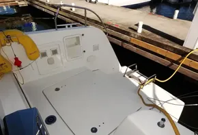Lagoon 42 catamaran 2020 model docked, showing the spacious cockpit area.