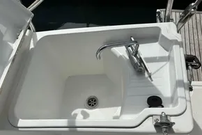 Sink on Jeanneau Sun Odyssey 440 yacht, 2019 model, with chrome faucet and drain.