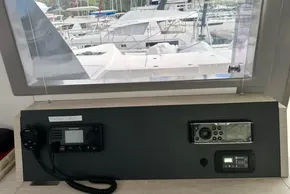Control panel on a 2021 Leopard 50 yacht, featuring navigation and communication equipment.