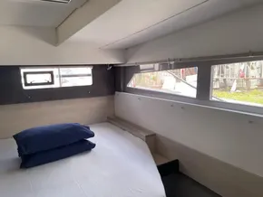 Interior of a 2020 Leopard 50 yacht cabin with bed and windows.