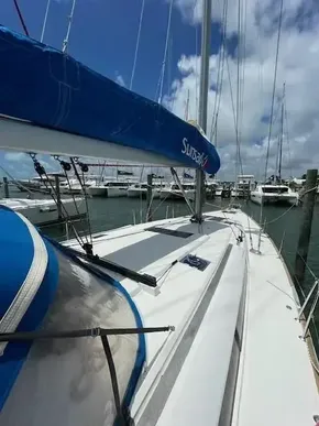 2017 Jeanneau Sun Odyssey 519 sailboat docked at a marina under a blue sky.