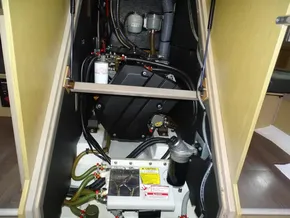 Engine compartment of 2017 Beneteau Oceanis 45 sailboat, showcasing mechanical components and wiring.