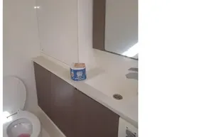 Modern bathroom in 2022 Leopard 45 yacht with toilet and sink.