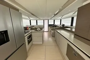 Luxurious interior of 2025 Robertson and Caine Leopard 46 Powercat yacht kitchen and lounge area.