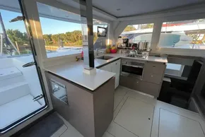 Modern kitchen interior on a 2022 Leopard 42 yacht, featuring sleek design and appliances.