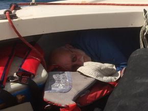 6’3” person sleeping under foredeck