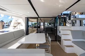 Luxurious 2025 Leopard 46 yacht interior with modern seating and dining area.