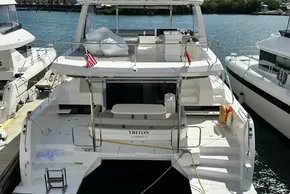 2025 Robertson and Caine Leopard 46 Powercat docked, featuring spacious deck and modern design.