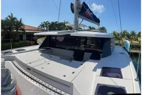 2022 Leopard 45 catamaran docked, featuring spacious deck and modern design.