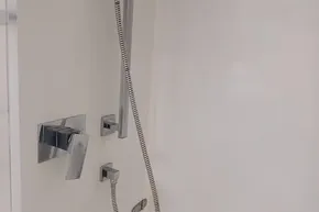 Modern shower fixtures in a 2017 Leopard 48 yacht bathroom.