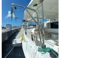 2020 Lagoon 46 catamaran docked, showcasing deck and seating area under clear blue sky.