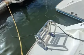 Stainless steel ladder on 2022 Leopard 45 yacht docked at marina.