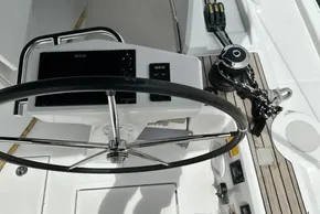 Steering wheel and controls of 2023 Beneteau Oceanis 51.1 yacht cockpit.