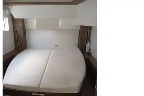 2020 Lagoon 46 yacht cabin with double bed and modern interior design.