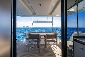 2025 Leopard 40 Powercat yacht with ocean view from deck, featuring seating area.