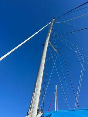 Sailboat mast against clear blue sky, Leopard 45, 2019 model.