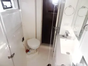 2017 Leopard 43 Powercat bathroom with toilet, sink, and shower.