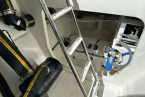 Engine room of 2025 Robertson and Caine Leopard 46 Powercat with ladder and equipment.