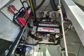 Engine compartment of a 2021 Leopard 45 catamaran with Yanmar engine and battery setup.