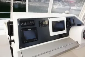 Control panel of a 2018 Leopard 43 Powercat with navigation screens and instruments.