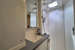 Modern bathroom interior on a 2021 Leopard 45 yacht, featuring sleek fixtures and ample lighting.