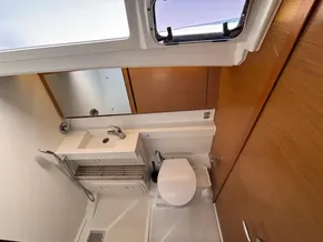 2019 Jeanneau Sun Odyssey 440 bathroom with modern fixtures and wooden accents.