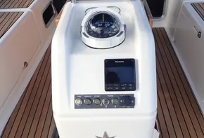 Jeanneau Sun Odyssey 440 cockpit with compass and control panel, 2019 model.