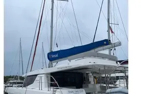 2022 Leopard 45 catamaran docked, featuring a blue Sunsail cover and sleek design.