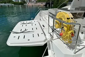 Leopard 53 Powercat 2022 yacht deck with safety equipment and water view.