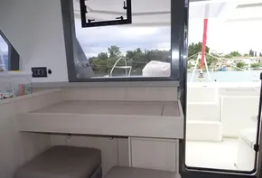 Interior of 2017 Leopard 45 catamaran with seating and outdoor view.