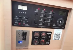Lagoon 42 2020 yacht control panel with gauges, switches, and QR code.